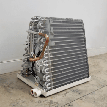 A-coil for central air conditioning sitting on top of a furnace