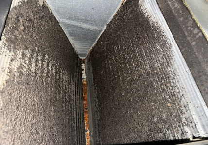 A dirty evaporator coil inside a home air conditioning system