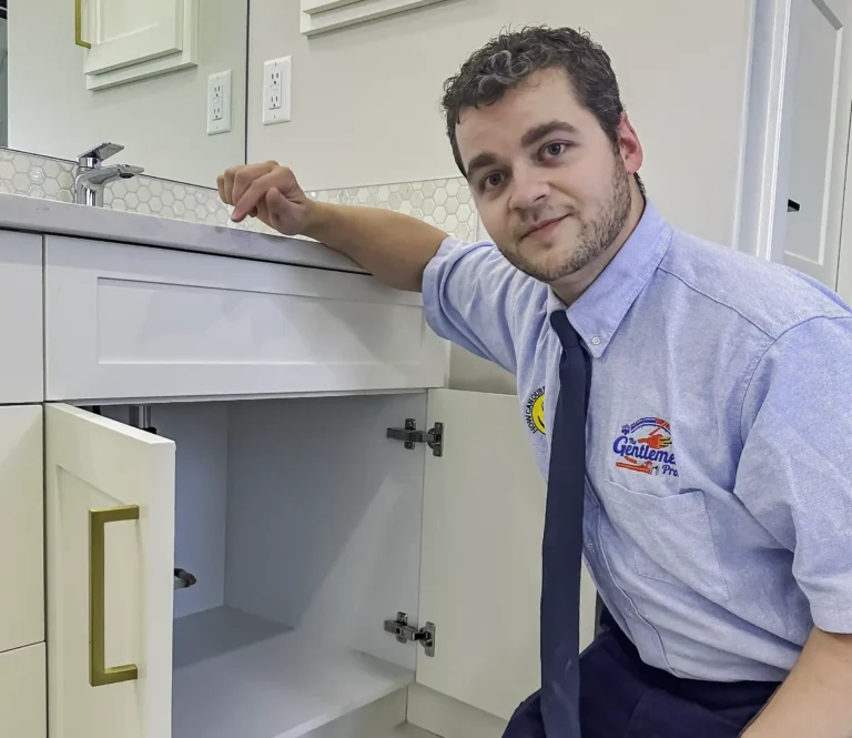 Plumber checks for leaks in bathroom